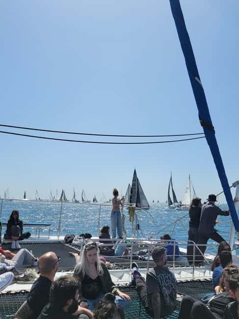 Barcelona: Luxury Catamaran Sunset Cruise - Sunset behind the city