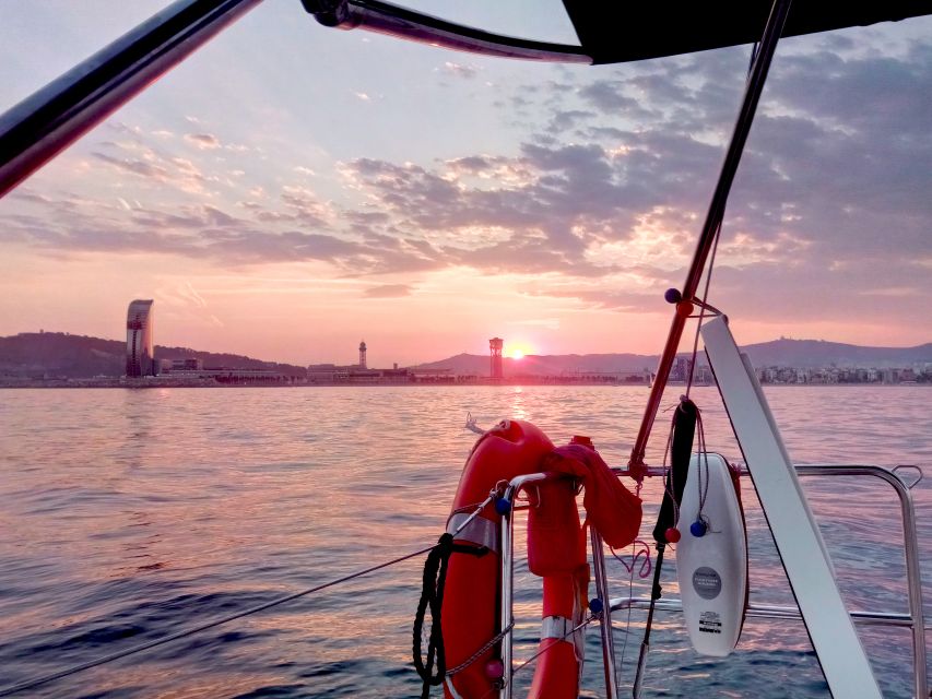 Barcelona: Sunset Sailing Tour with Open Bar & Snacks - The swim stop and the limits of sea life