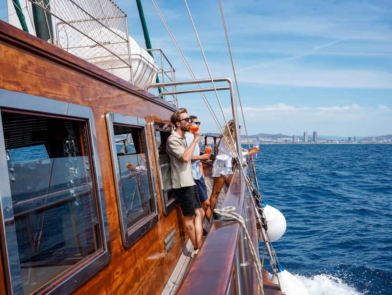 Barcelona: Wooden Boat Sailing with Tapa and Welcome Drink - What the crew does, and what they do not do