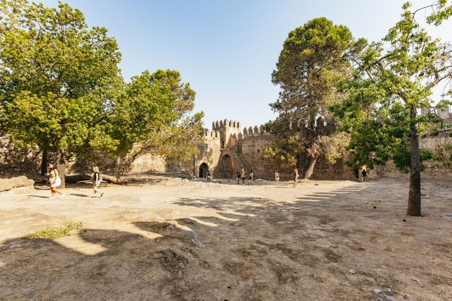 From Seville: Pueblos Blancos and Ronda Full-Day Trip - Zahara de la Sierra, white houses below the mountains