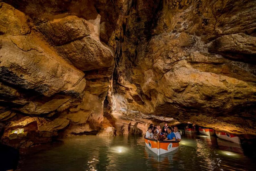 From Valencia: Caves of San José Guided Excursion and Ticket - Entering the underground river at Vall d’Uixó