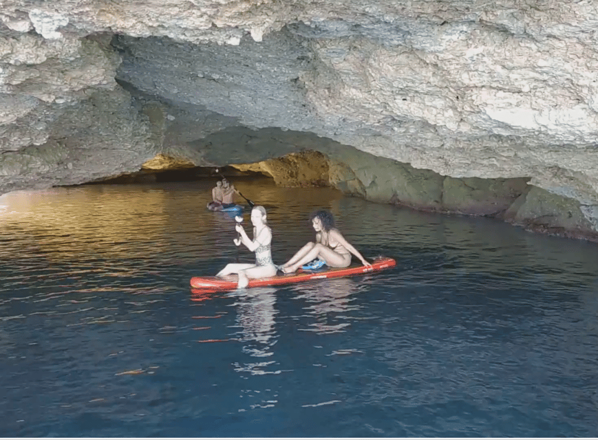 Ibiza: Snorkeling and SUP Paddle, Beach and Cave Boat Tour - Cala Bassa: sand, turquoise water, and a relaxed second stop