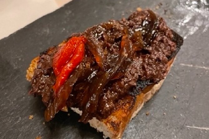 Madrid by Night Small Group Tour: Stories, Sights and Tapas Bites - The first bar: three tapas and a drink included