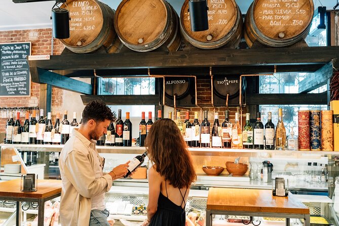 Madrid Tapas & Wine Tour with Rooftop Views and Local Guide - Plaza Mayor and the Iberian ham stop