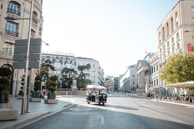 Madrid Welcome Tour with Local Guide in Eco Tuk Tuk Private - Starting under the Royal Palace