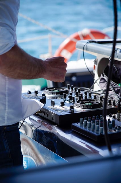 Malaga: Catamaran Sailing Cruise with Swimming & Optional DJ - Drinks, bar service, and extra costs
