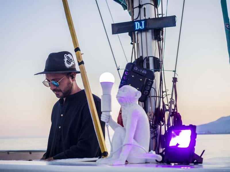 Malaga: Sailing Catamaran Sunset Cruise with Live DJ & Drink - Cava, Sea Air, and the Evening Toast
