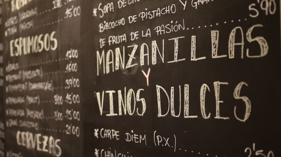 Málaga: Wine & Tapas Tour - A family-run grocery stop for Iberian ham