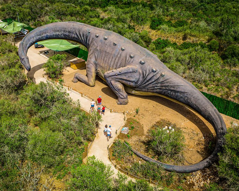 Mallorca: Dinosaurland and Caves of Hams Combined Ticket - The Blue Cave uses film and light to tell the story