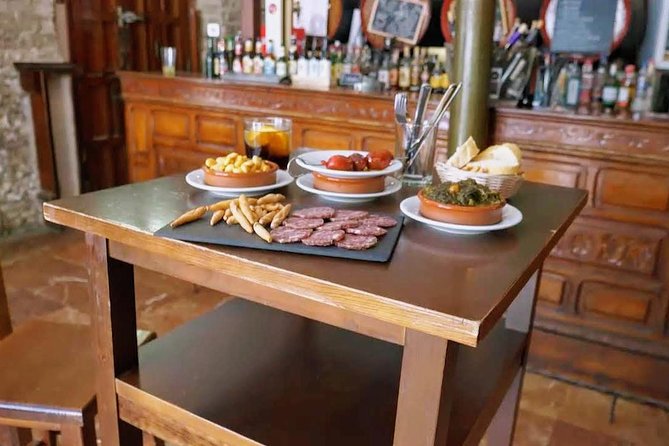 Sevilla Food Tour: Tapas, Wine, History & Traditions - Santa Cruz, family recipes, and a sweet finish