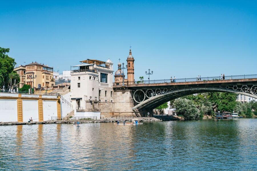 Seville: 1-Hour Guadalquivir River Sightseeing Eco Cruise - Old towers beside newer Seville