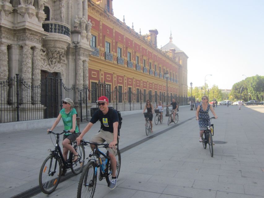 Seville: Highlights City Bike Tour - Crossing to Triana for tile and flamenco culture