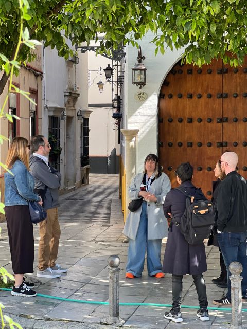 Seville: Small Group Jewish Quarter Tour with Tapas & Drinks - Starting beneath Seville’s great monuments