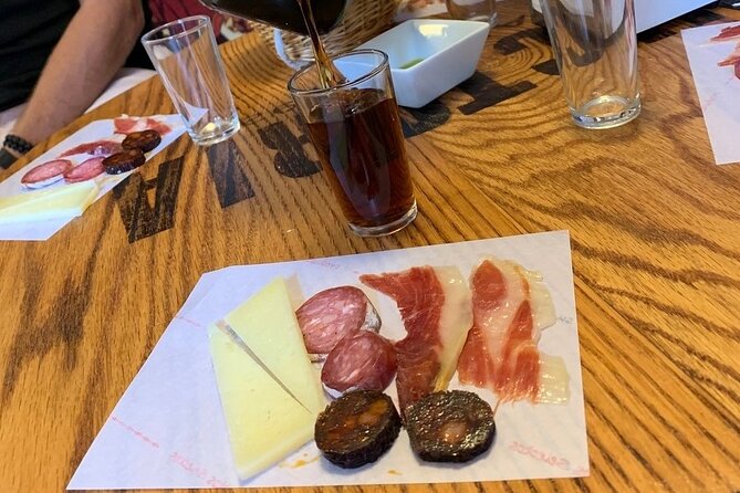 Taste of Malaga Tour : Tapas, History and Local Customs - Vermouth and Iberian ham at a traditional grocery shop