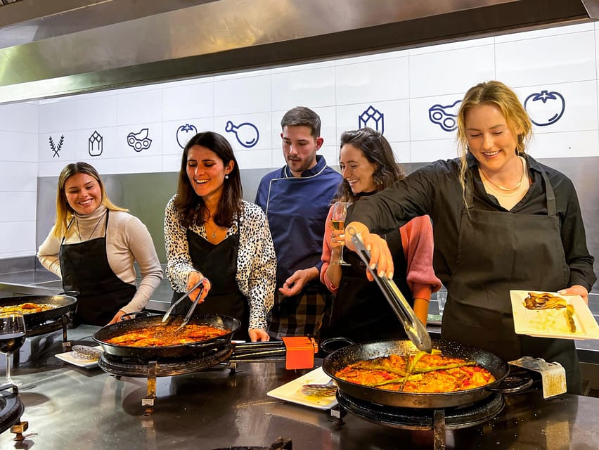 Valencia: Paella Cooking Class with Central Market Tour - Sitting down to eat what you made