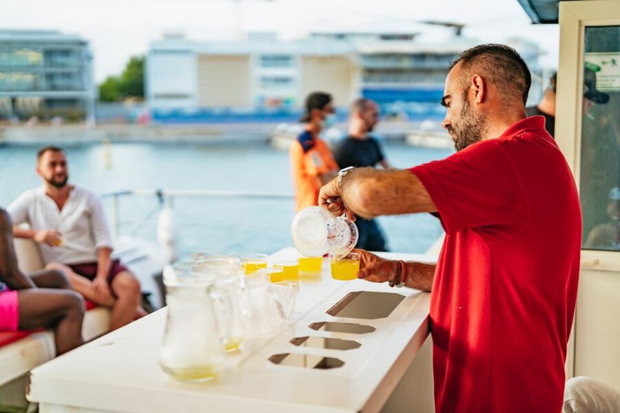 Valencia: Sunset or Daytime Catamaran Cruise with Drink - The drink, bar, and onboard mood