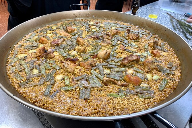 Valencian paella cooking class, tapas and visit to Ruzafa market. - Making Valencian paella instead of watching it